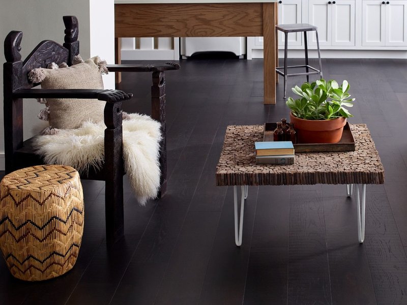 white furniture in contrast with dark brown hardwood floor from Traditional Floors in Milan, IL