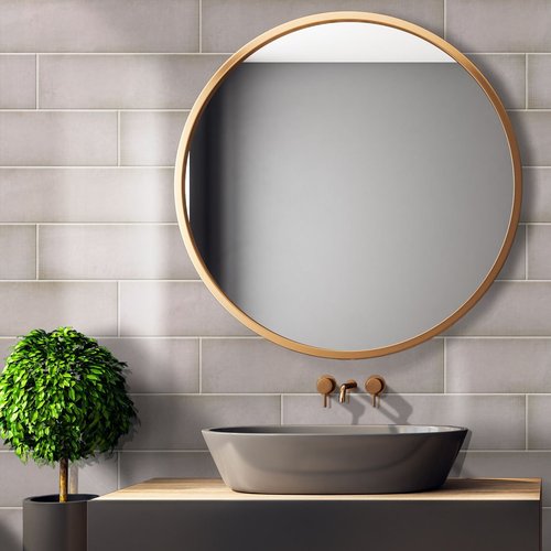 big round mirror in bathroom on gray wall tiles from Traditional Floors in Milan, IL